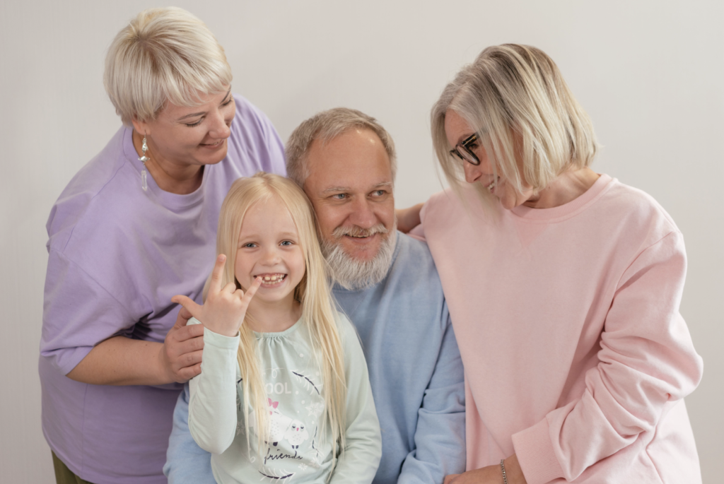 grandparents with their daughter and granddaughter