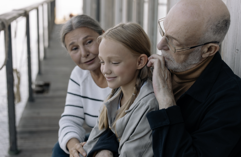 grandparents with their granddaughter